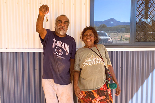 Kathleen Dixon and Douglas Multa receiving the keys to their new home. 